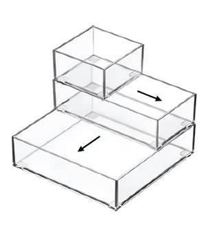 Three transparent SLIDE drawer organizer boxes from BNB x VCN are stacked in a staircase formation and feature black arrows showing how to pull them out—ideal as stackable organizers for easy storage and access.