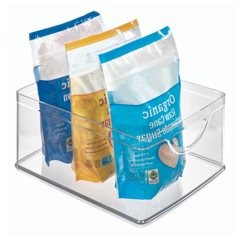 Durchsichtige Box mit drei Zuckerbeuteln im gelb-blauen Design.