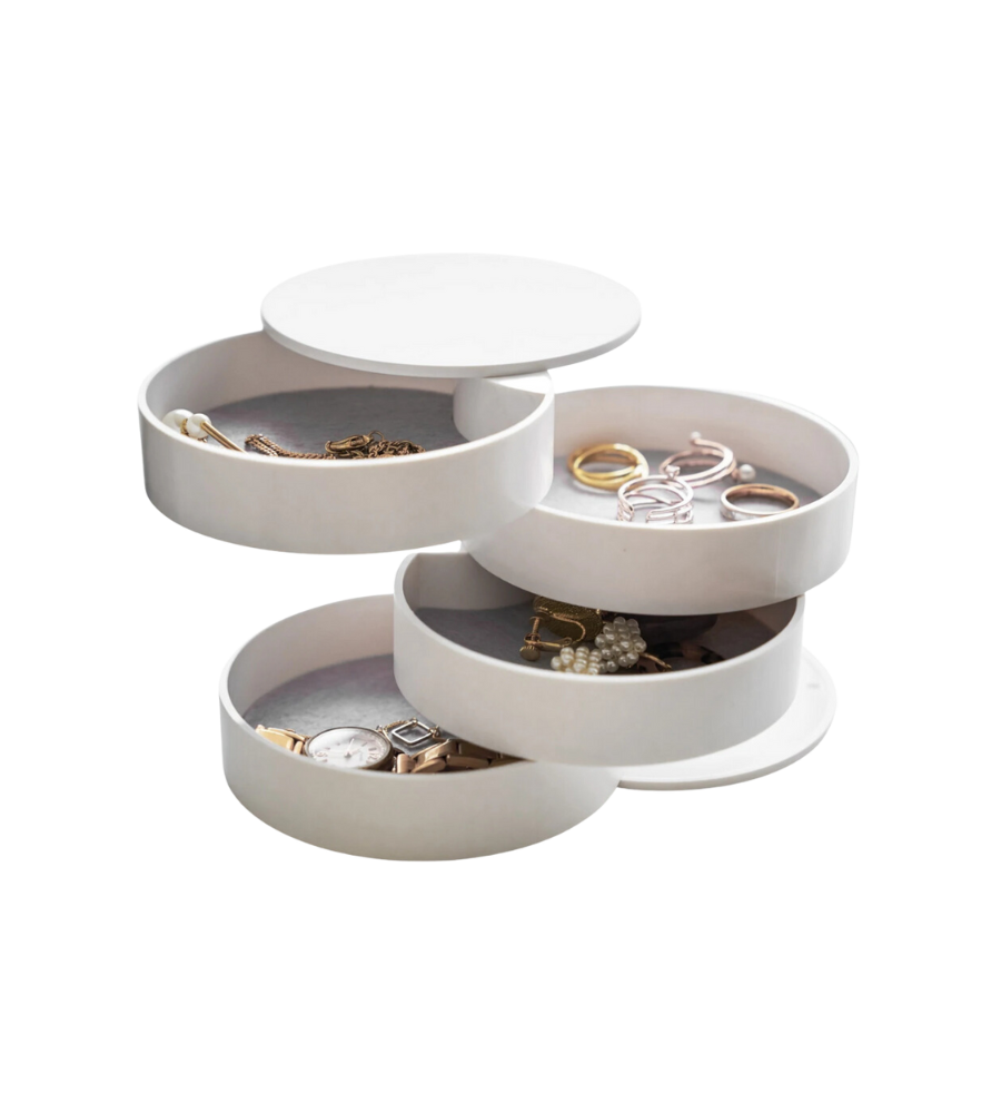 Türmeckiges Schmuckkästchen entfaltet Fächer mit Ringen, Uhren und Armbändern in neutraler Umgebung.